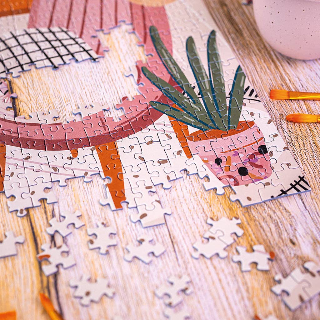 Puzzle 1000 pièces L’Atelier à moitié assemblé. Illustration en train d’apparaître.