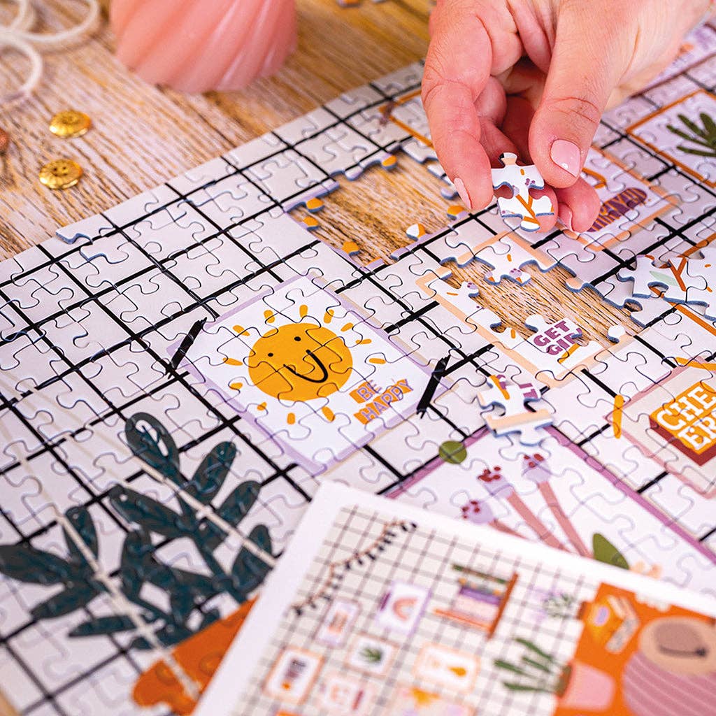 Gros plan sur les pièces du Puzzle 1000 pièces L’Atelier. Découpe classique et ajustement parfait.