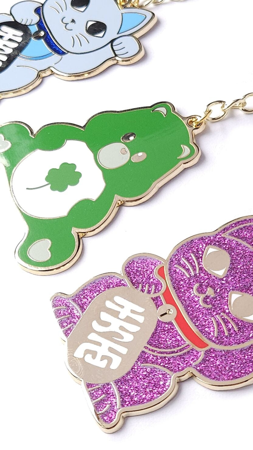Porte-clés Maneki Neko rose pailleté – Chat porte-bonheur doré studio inktvis