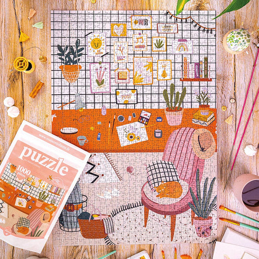 Puzzle L’Atelier encadré et accroché au mur comme œuvre décorative.