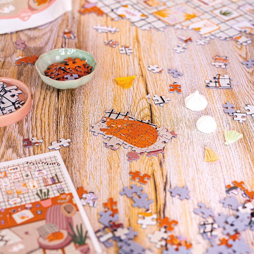 Puzzle 1000 pièces L’Atelier ouvert, pièces en vrac prêtes à assembler.