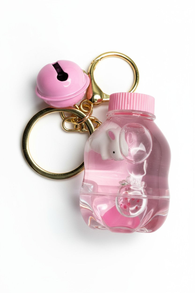 Porte-clés Japan Style Lapin  dans flacon kawaii avec liquide rose scintillant. Accessoire girly original.